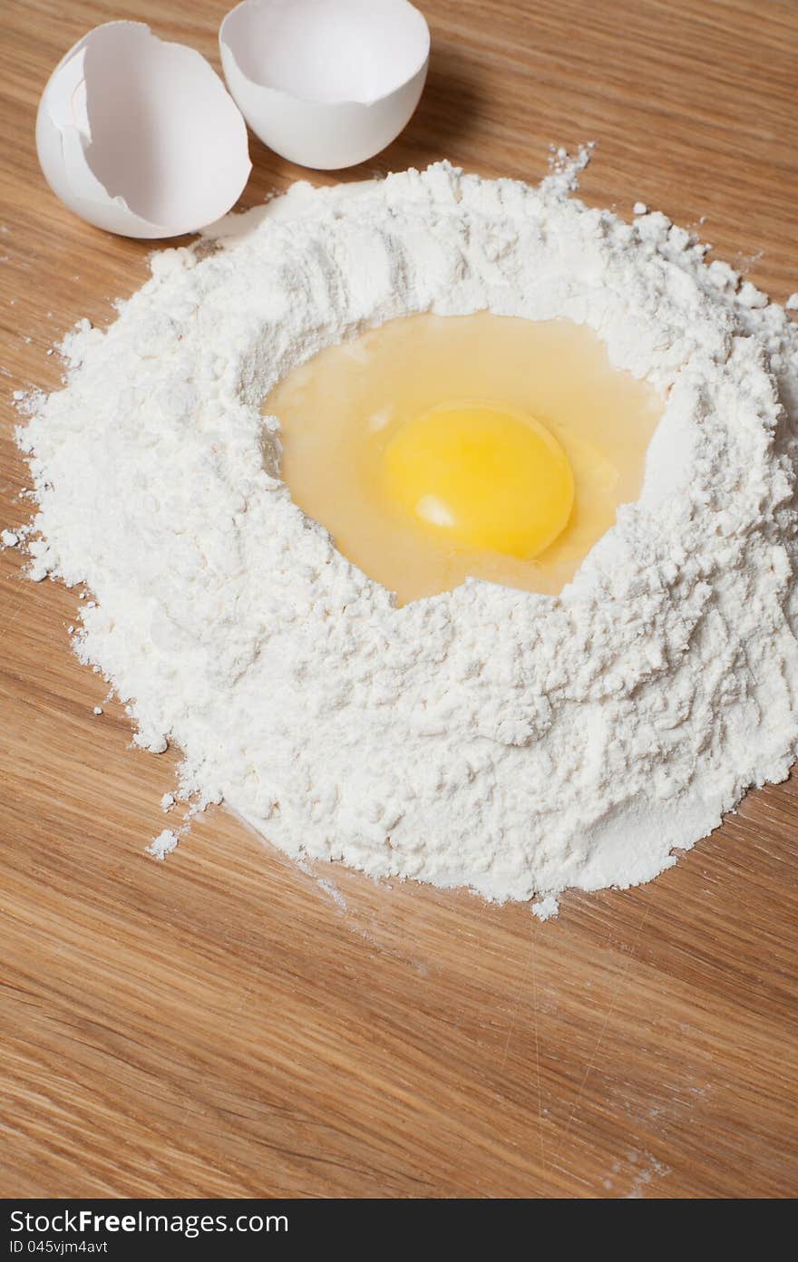 Flour with yolk on the wood table