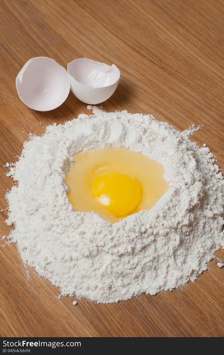 Flour and eggs on the wood table