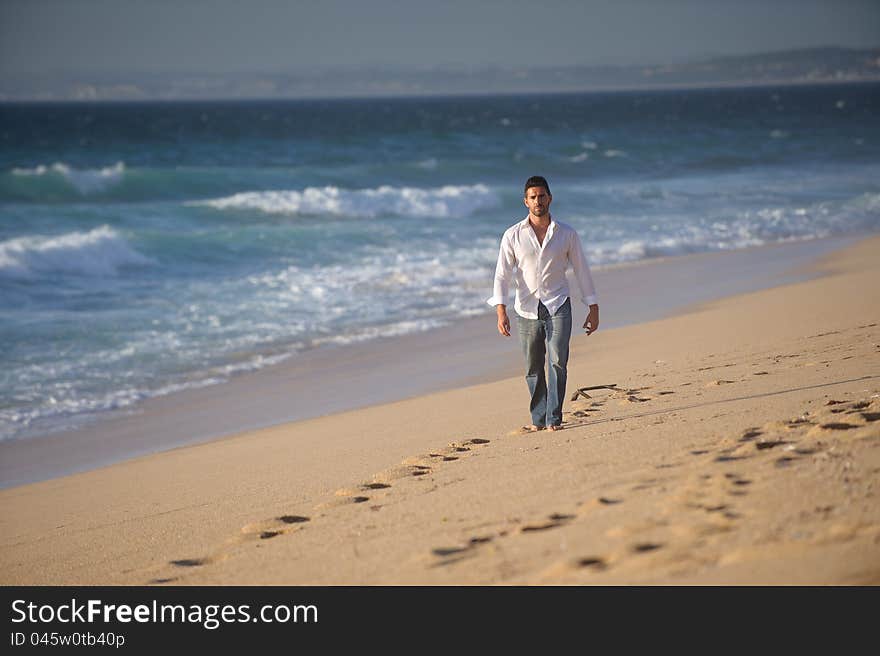 Man walking alone at the beach