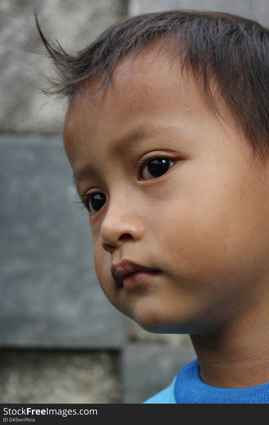 A little boy was sad while look at into the distance. A little boy was sad while look at into the distance.