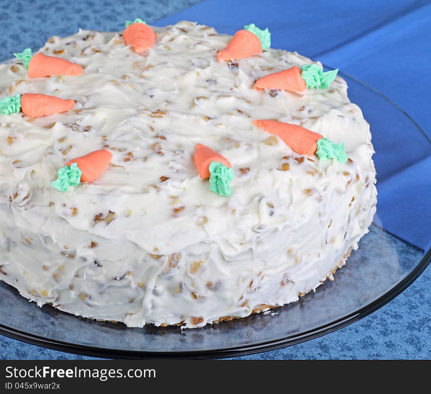 Whole carrot layer cake on a platter. Whole carrot layer cake on a platter