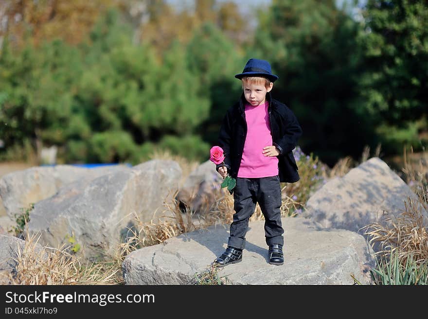 Park a rock the child a hat a rose style. Park a rock the child a hat a rose style