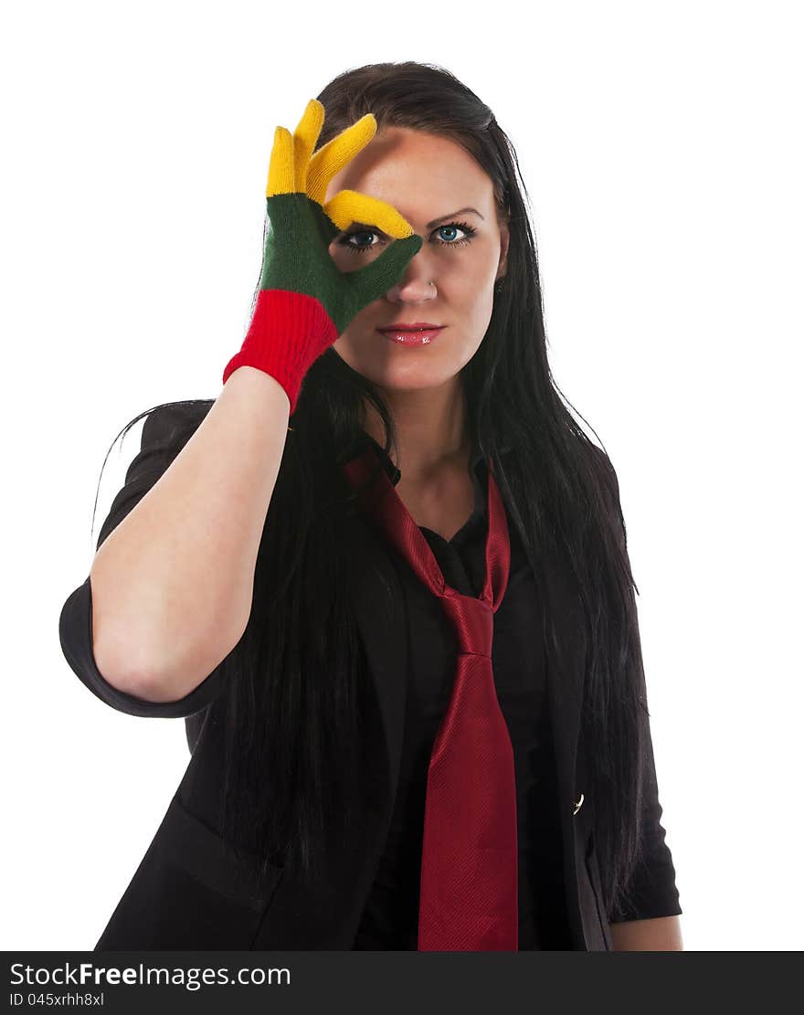 Pretty young woman with long hair wering Lithuanian flag glove looking through OK sign. isolated against white background. Pretty young woman with long hair wering Lithuanian flag glove looking through OK sign. isolated against white background