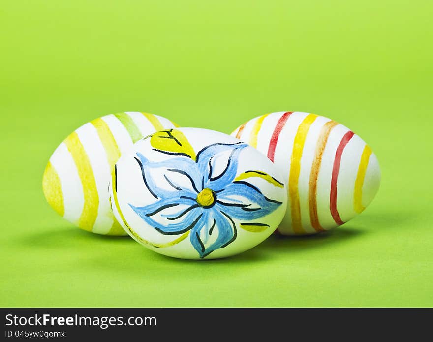 Painted Easter eggs on a green background