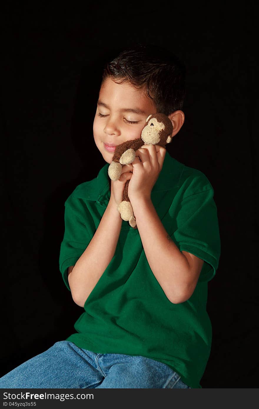 Boy Hugging Stuffed Monkey