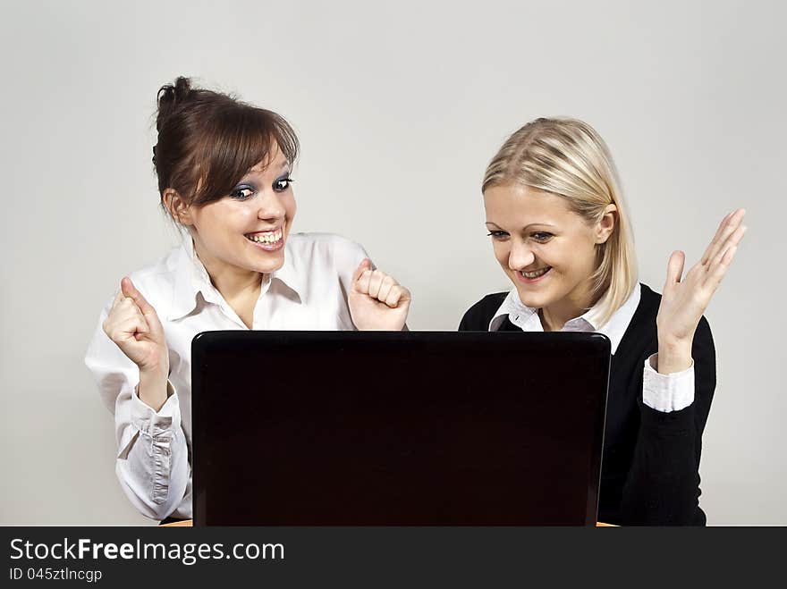 Beautiful girls looking laptop