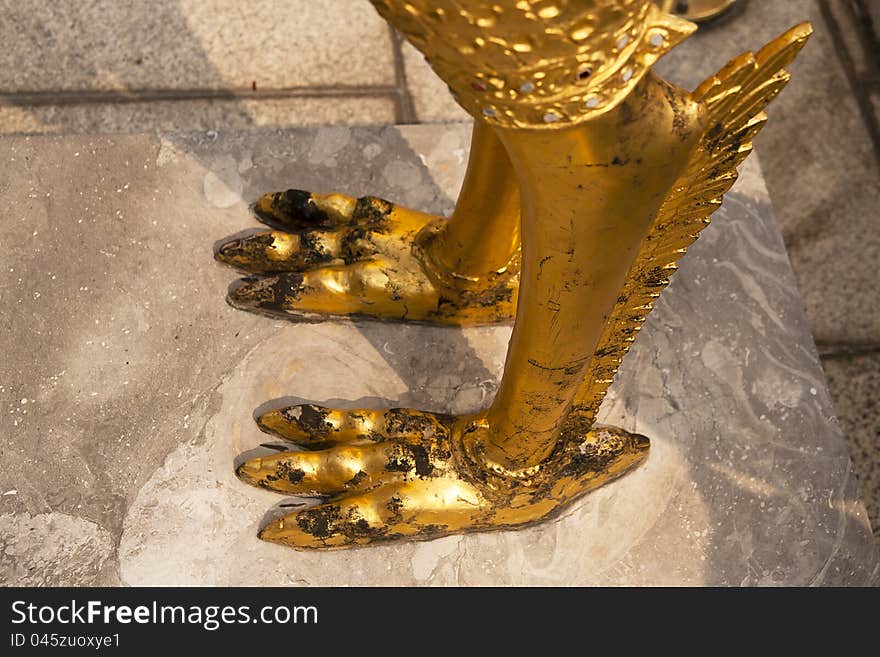 Foot of Guardian angel on cement fall