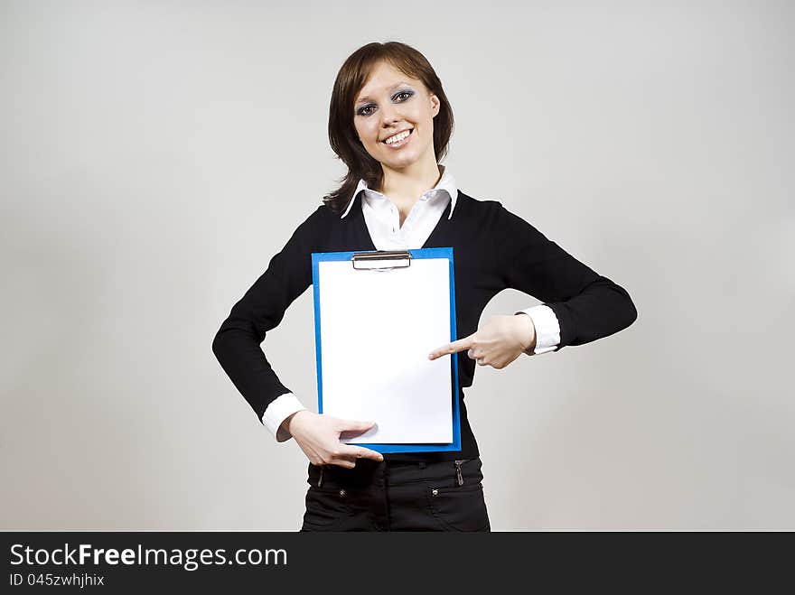 girl indicates standing on the document