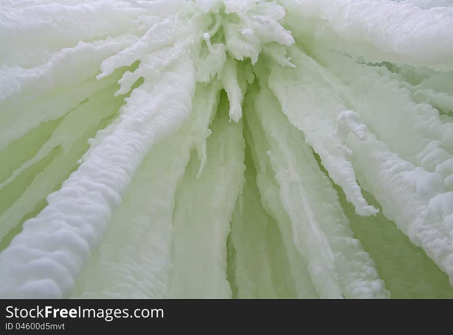 Thick icicles hanging from a water fall, bottom view of the wide-angle. Thick icicles hanging from a water fall, bottom view of the wide-angle