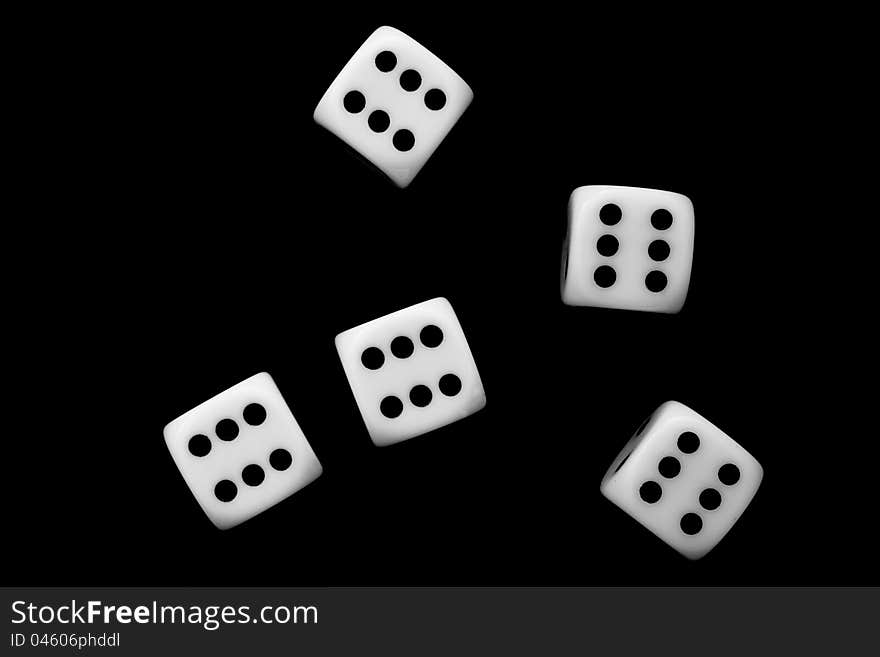 Five dice on black background