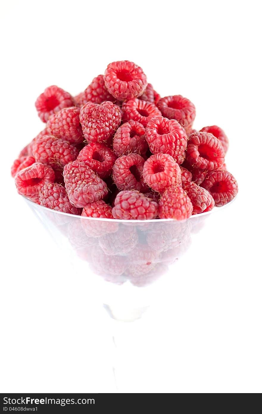 Bowl of raspberries isolated on white