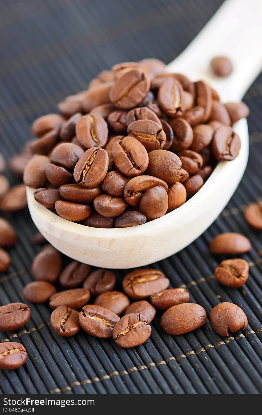 Coffee in spoon, background texture, close-up