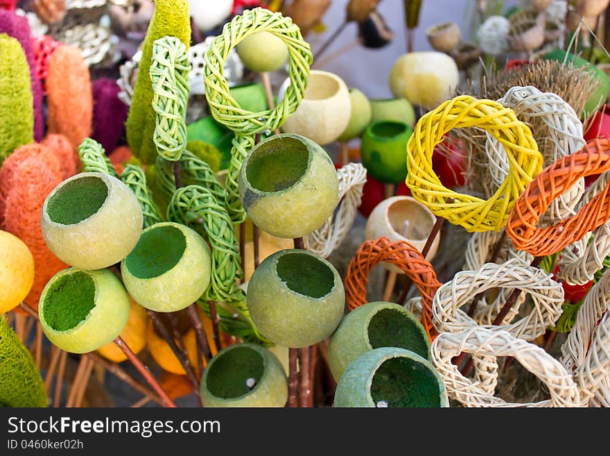 Colored poppy pods and colored wickerwork. Colored poppy pods and colored wickerwork