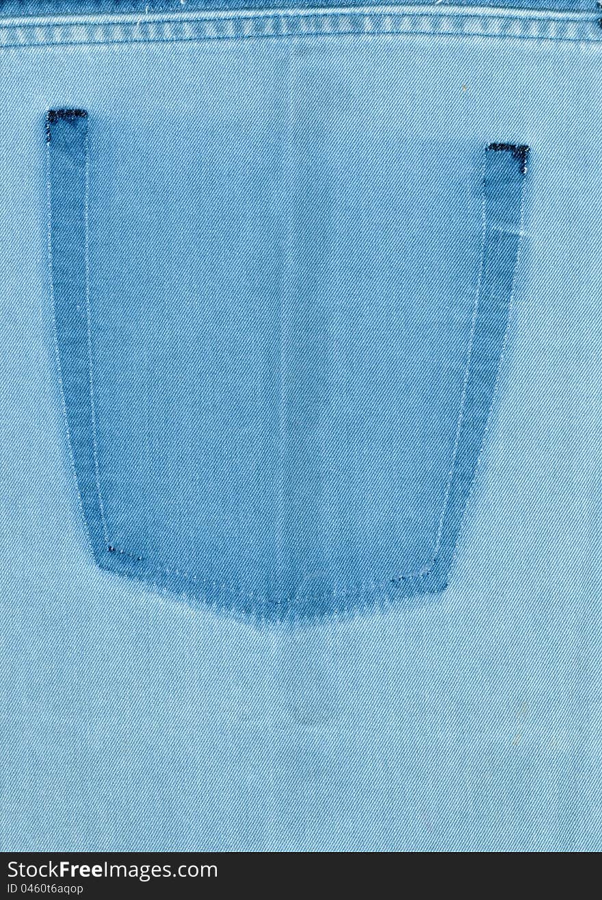 The texture of denim with a trace of the torn pocket