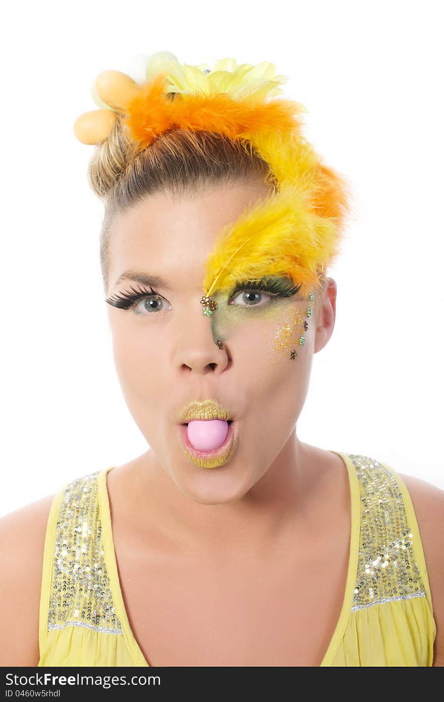 Picture of an easter girl dressed in yellow, with eggs in her hair and mouth, on a white, isolated background