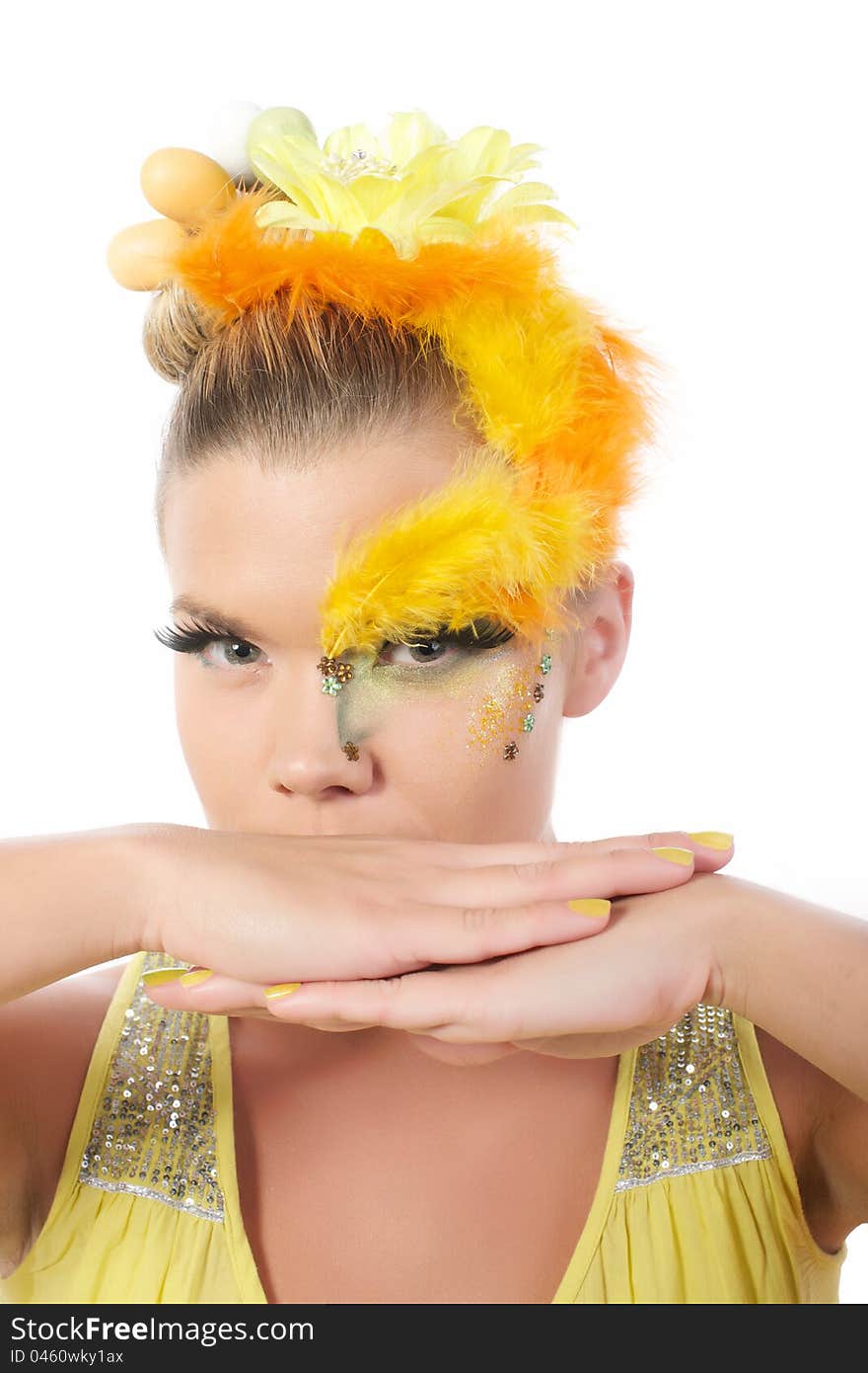 Picture of an easter girl dressed in yellow, with eggs in her hair, on a white, isolated background