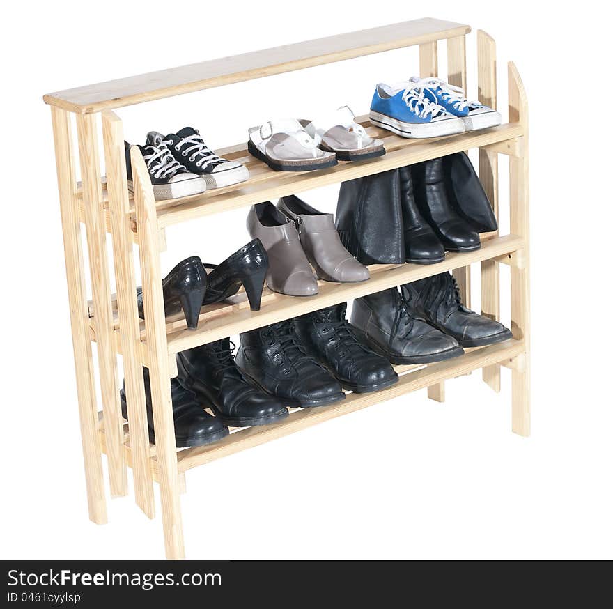 Wooden shelves with shoes, isolated on white