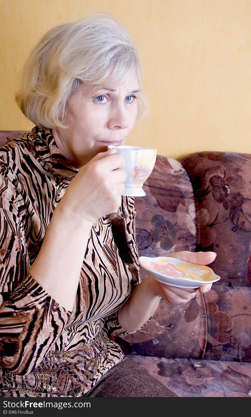 Tea party. Woman relaxing drinks tea