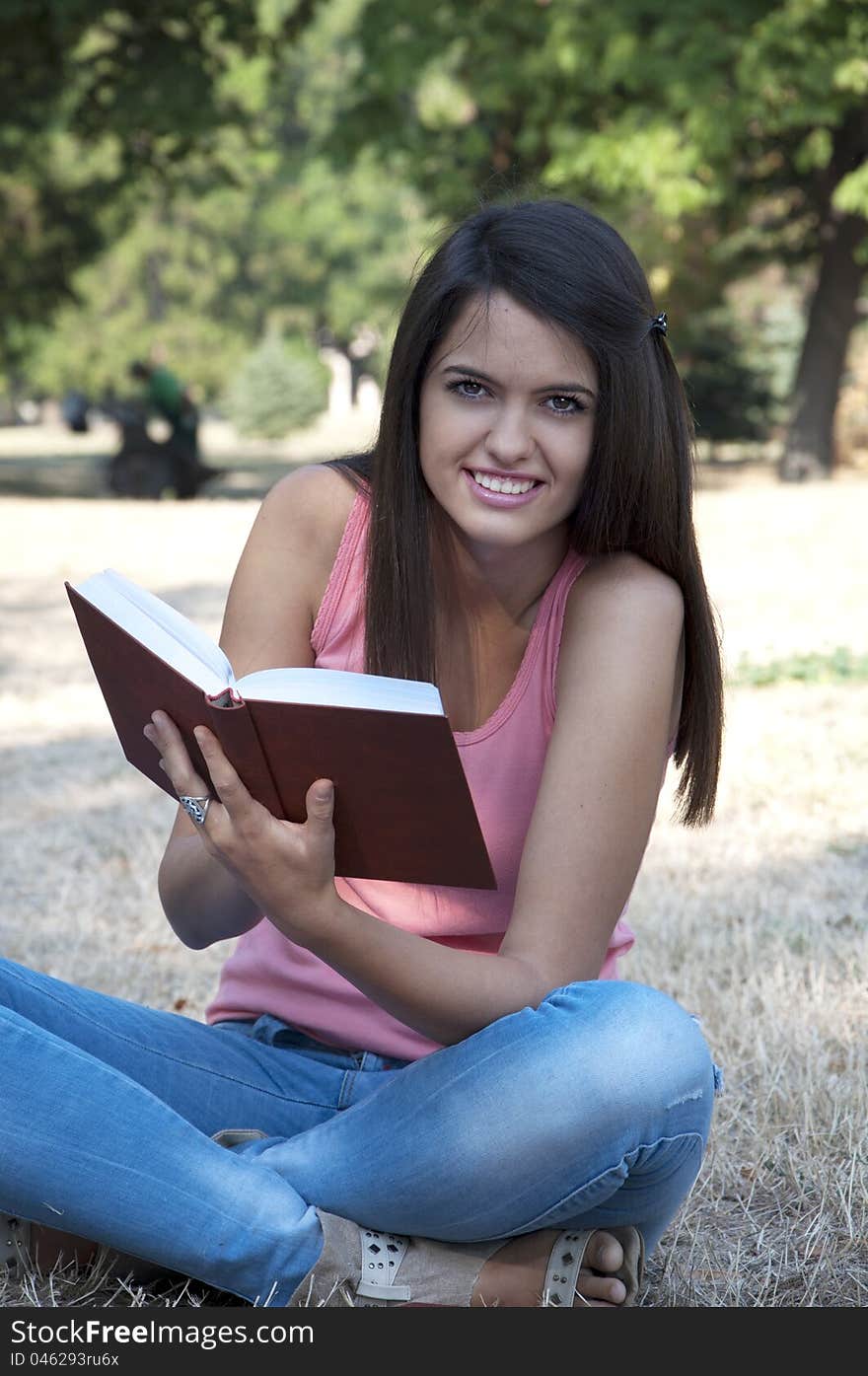 Young woman photographed in  park. Young woman photographed in  park