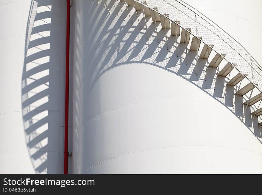 Close up of white storage tank with stairs