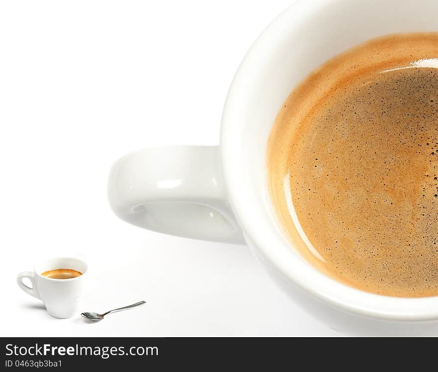 Espresso coffee in a white cup with spoon on white background. Espresso coffee in a white cup with spoon on white background