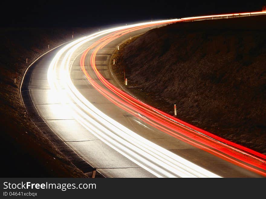 Trails of cars and trucks on the road at night. Trails of cars and trucks on the road at night.