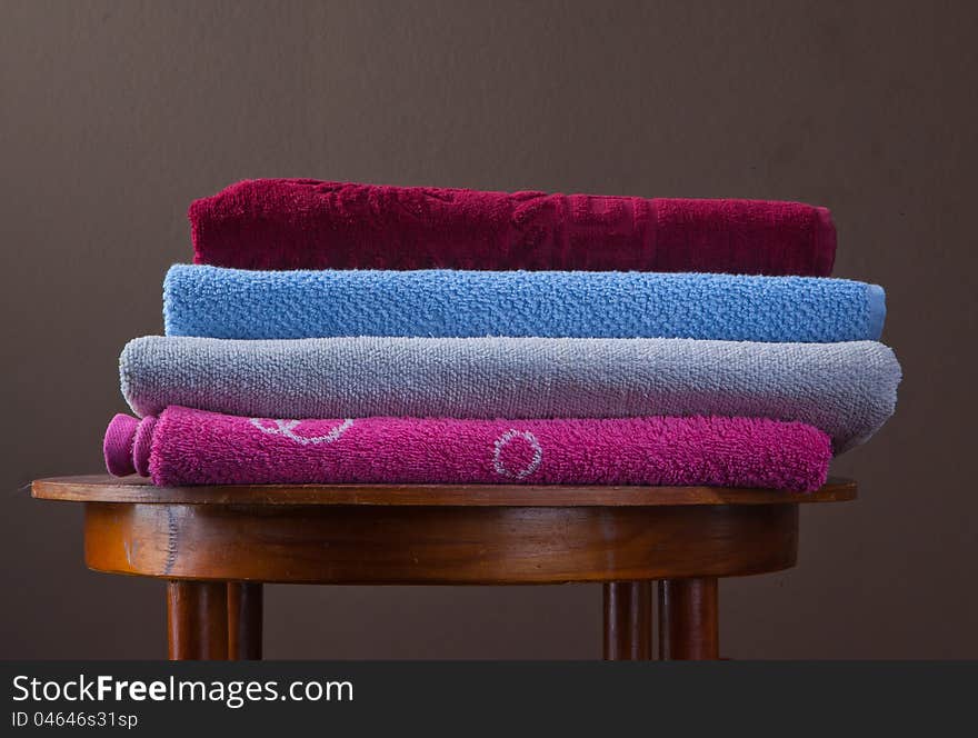 Pile of cotton Colorful towels On a table