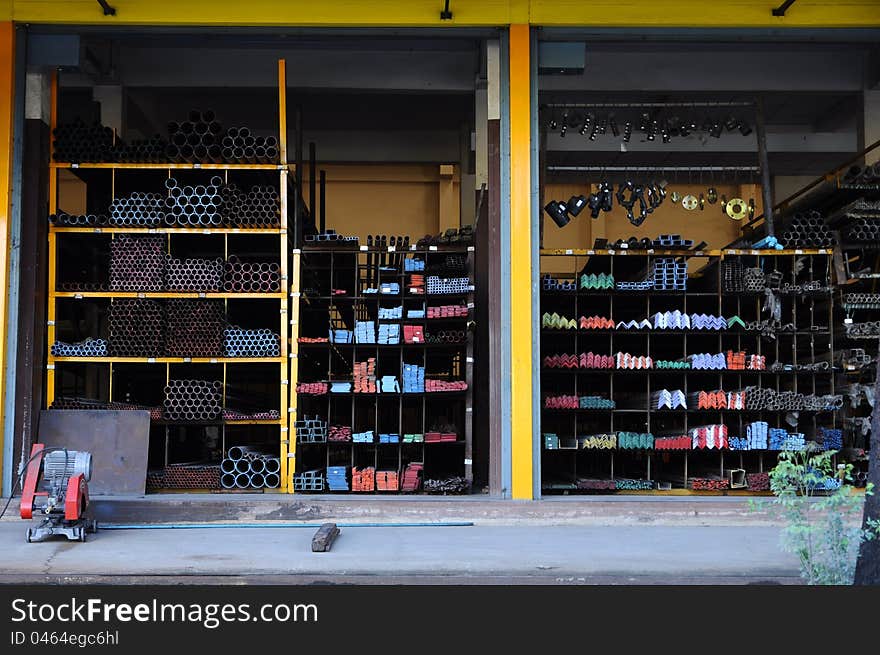 A series of different sizes metal pipes on shelf. A series of different sizes metal pipes on shelf