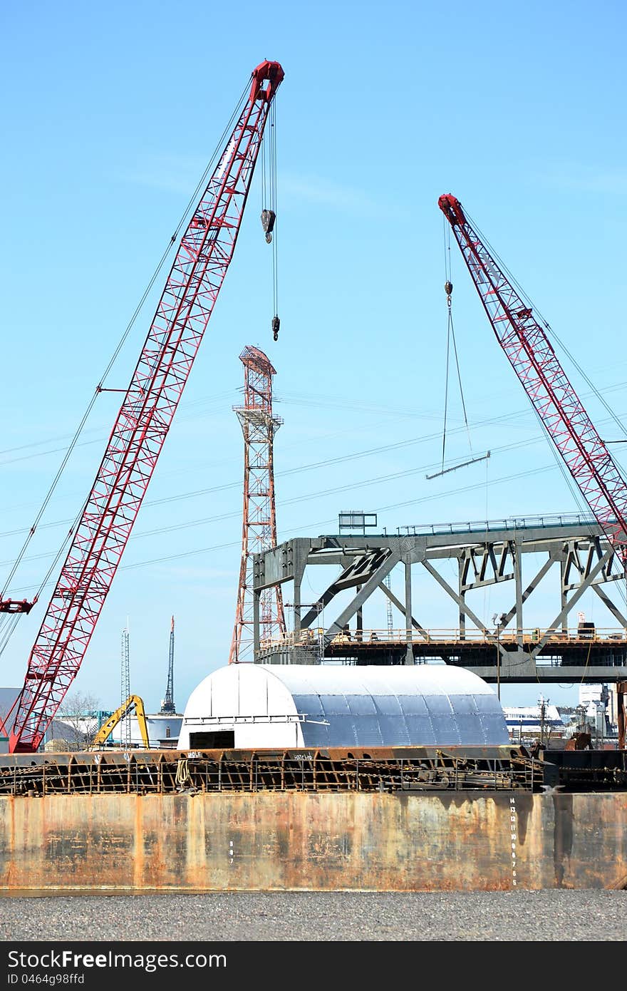 Industrial work site with cranes. Industrial work site with cranes