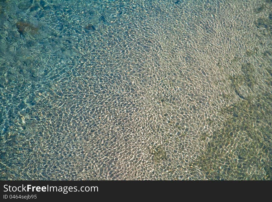 Abstract shallow water pond texture with waves. Abstract shallow water pond texture with waves