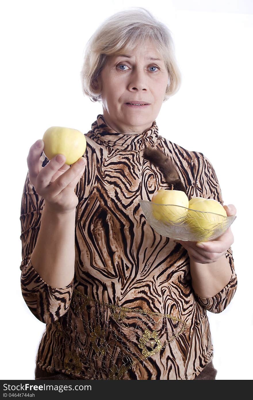 Mature woman holding fruit against white background. Mature woman holding fruit against white background