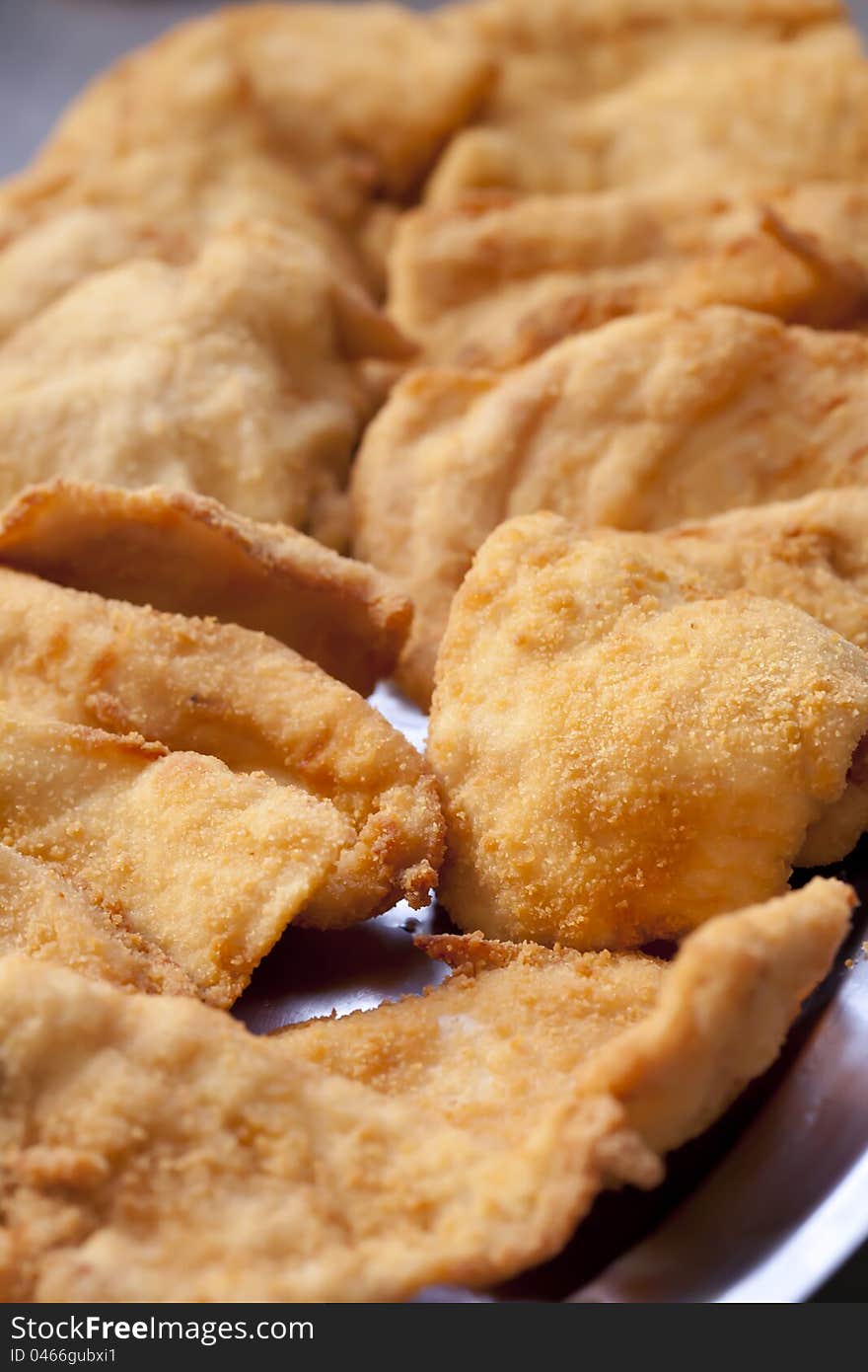 Closeup of breaded chicken breasts with egg and bread. Closeup of breaded chicken breasts with egg and bread