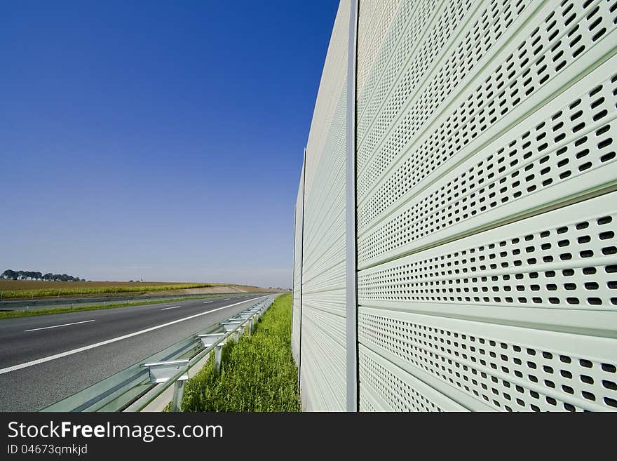 Sound absorption walls on a highway. Sound absorption walls on a highway