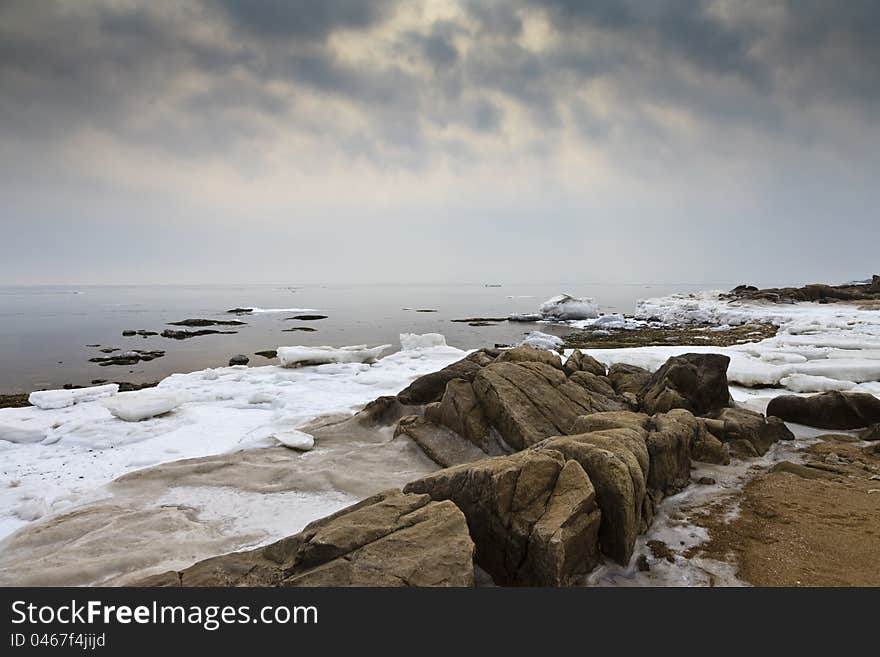 Ice melting on a beach, Taili, Xingcheng, northeast China. Ice melting on a beach, Taili, Xingcheng, northeast China.