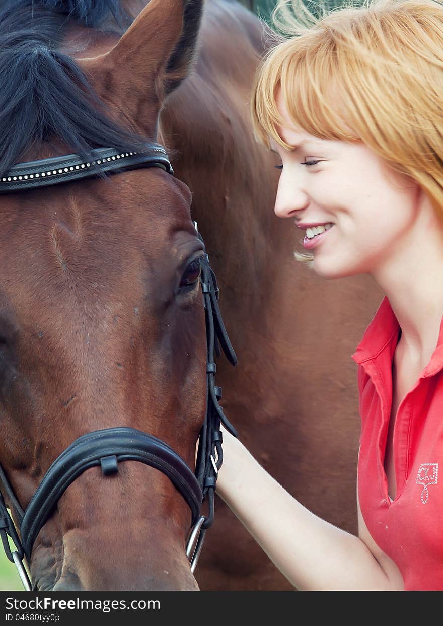 Portrait of young cute girl  with her horse