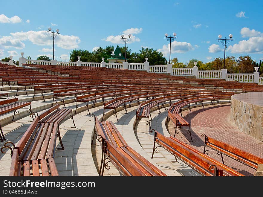 Benches facing a semicircle in front of the stage