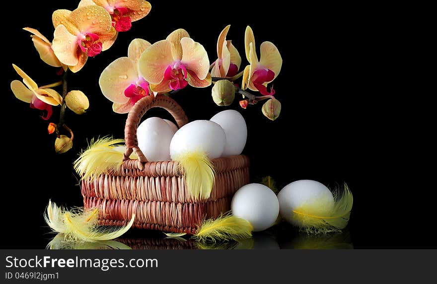 Easter sunrise, white eggs and spring yellow orchid with drop of dew. Easter sunrise, white eggs and spring yellow orchid with drop of dew