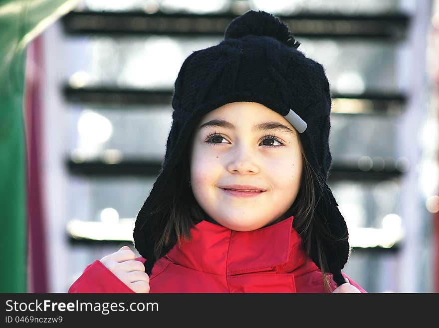 Girl dressed in red suite with black hat. Girl dressed in red suite with black hat