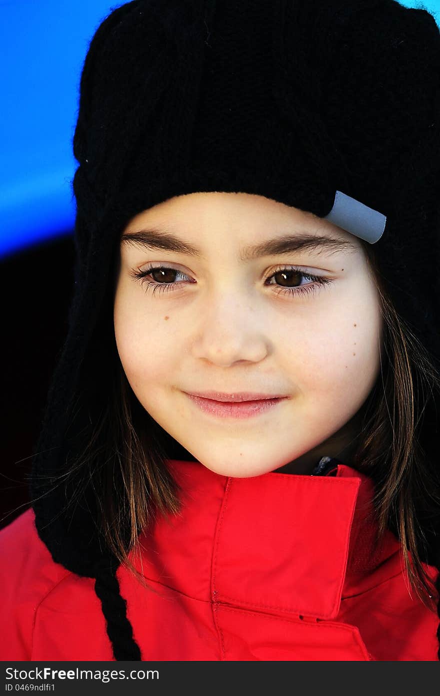 Girl dressed in red suite with black hat. Girl dressed in red suite with black hat