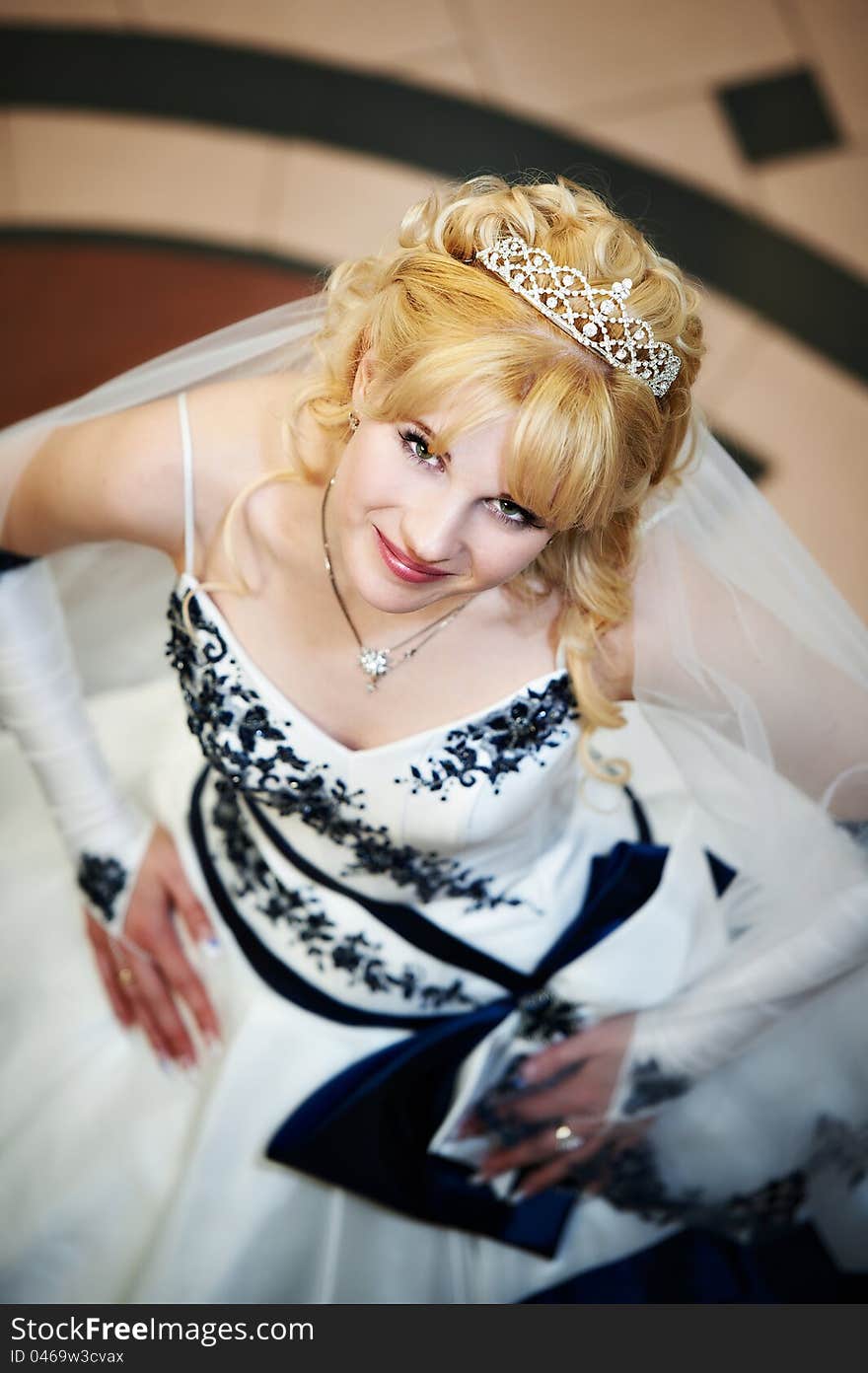 Beautiful bride in wedding dress indoors