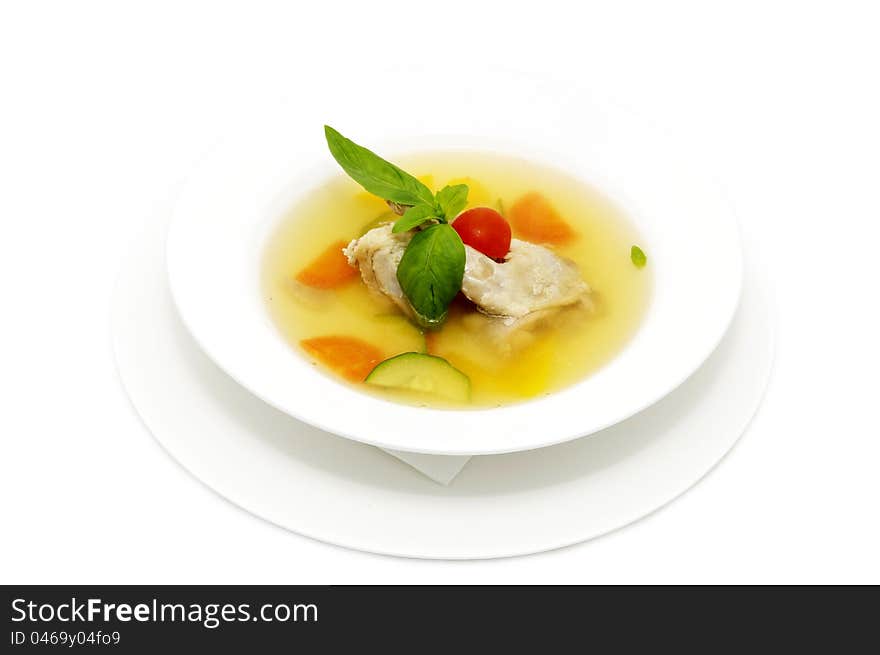 Quail broth with vegetables decorated with mint. Quail broth with vegetables decorated with mint