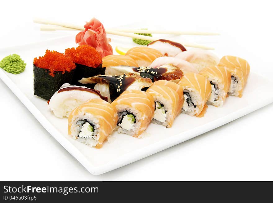 A large plate of Japanese sushi on white background