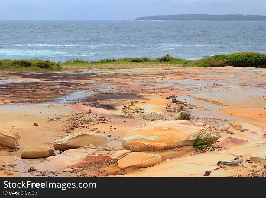 A parched landscape at the ocean &#x28;the Sydney Basin with its characteristic sandstone&#x29;. A parched landscape at the ocean &#x28;the Sydney Basin with its characteristic sandstone&#x29;