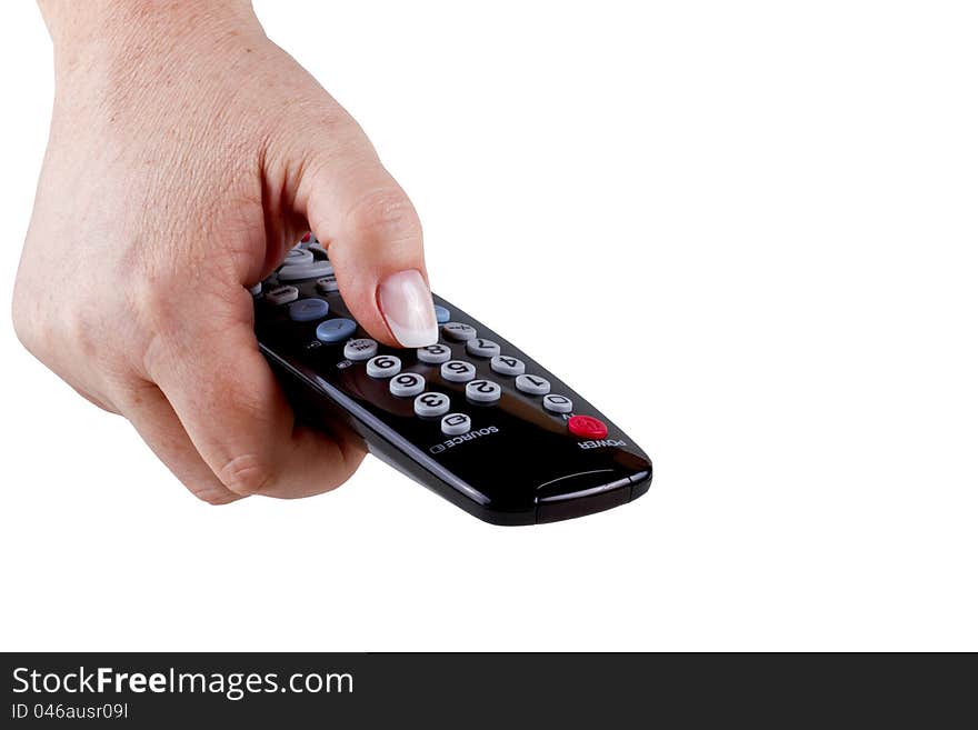 The hand holding a tv remote control