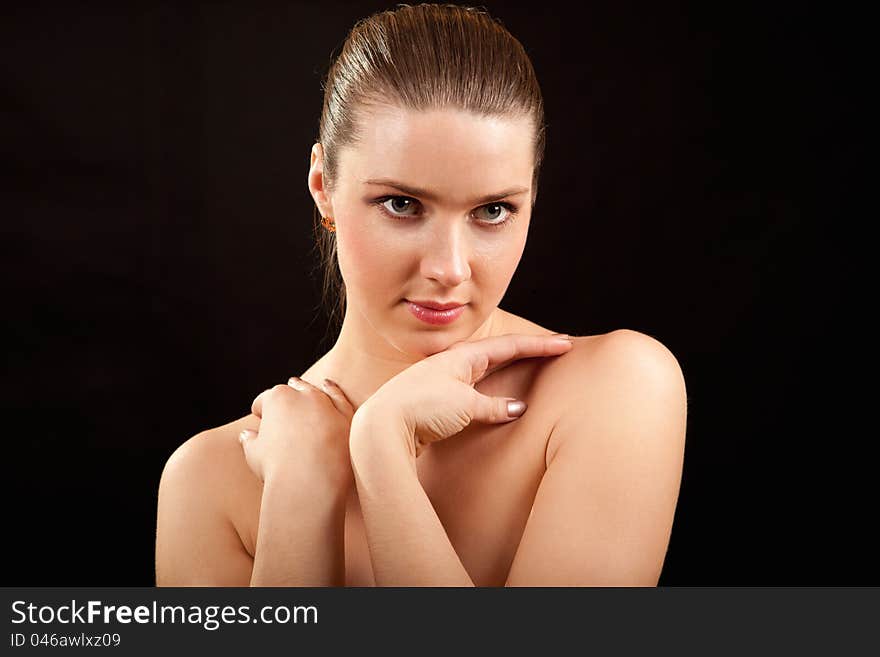 Portrait of the young girl on a black background. Portrait of the young girl on a black background