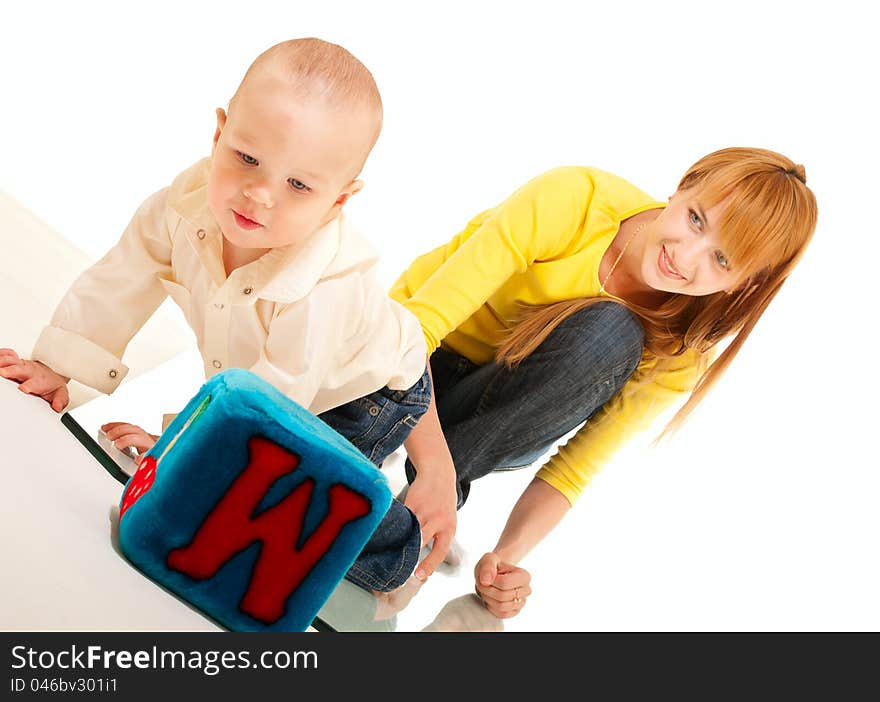 Son and mother play and study on white background