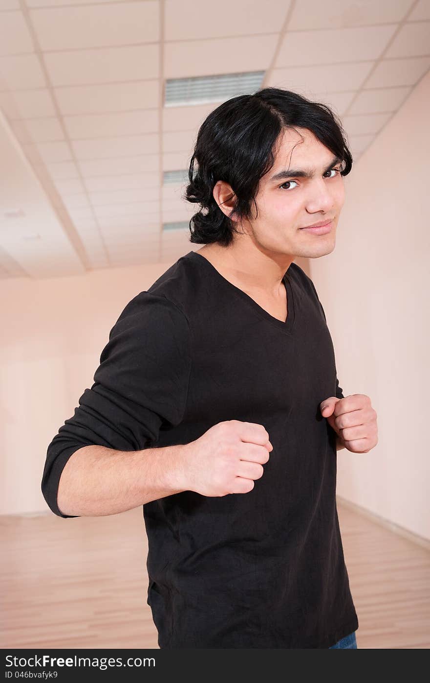 Fighter young hispanic man in training hall. Fighter young hispanic man in training hall