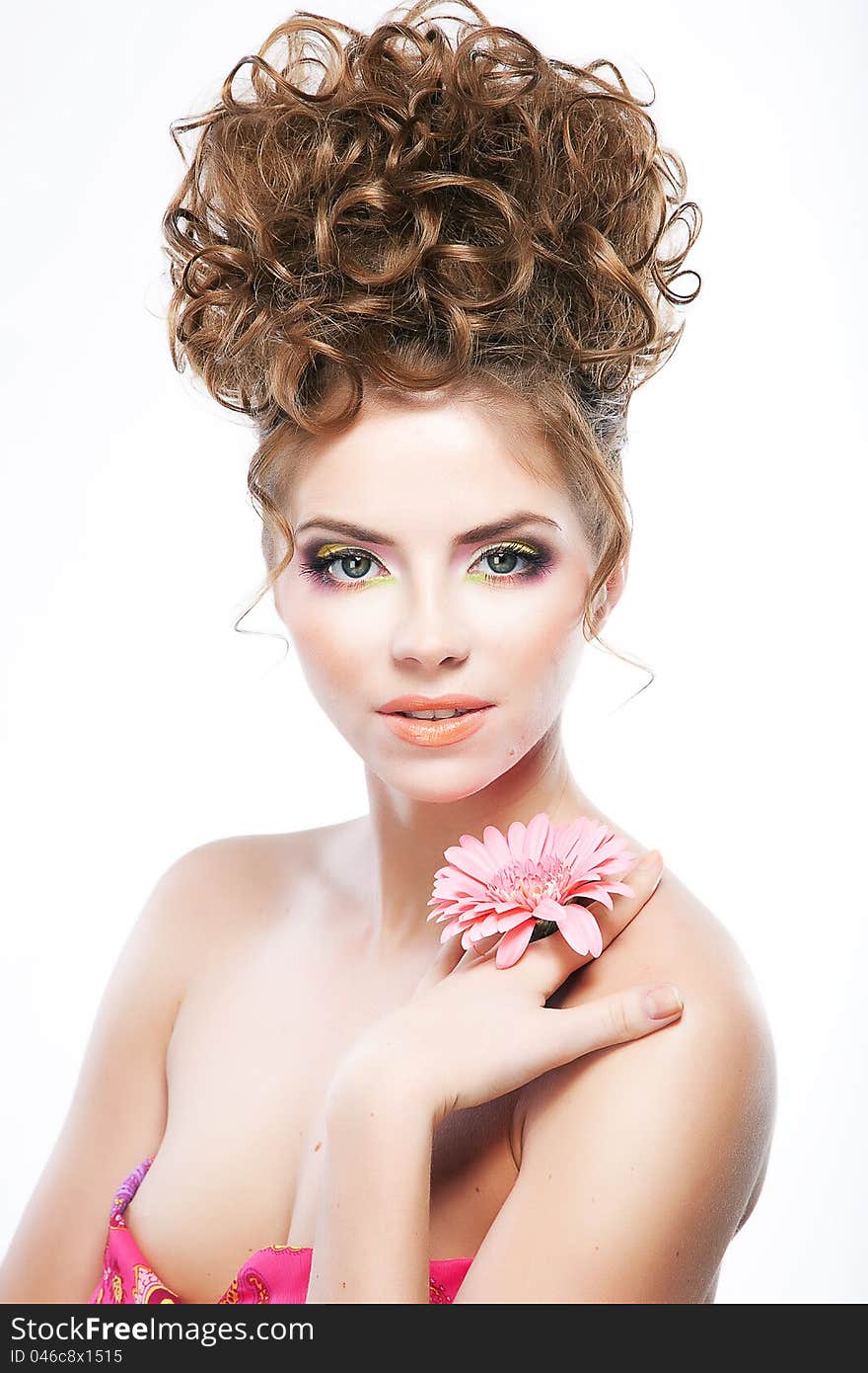 Lovely brunette woman with flower. Bright makeup