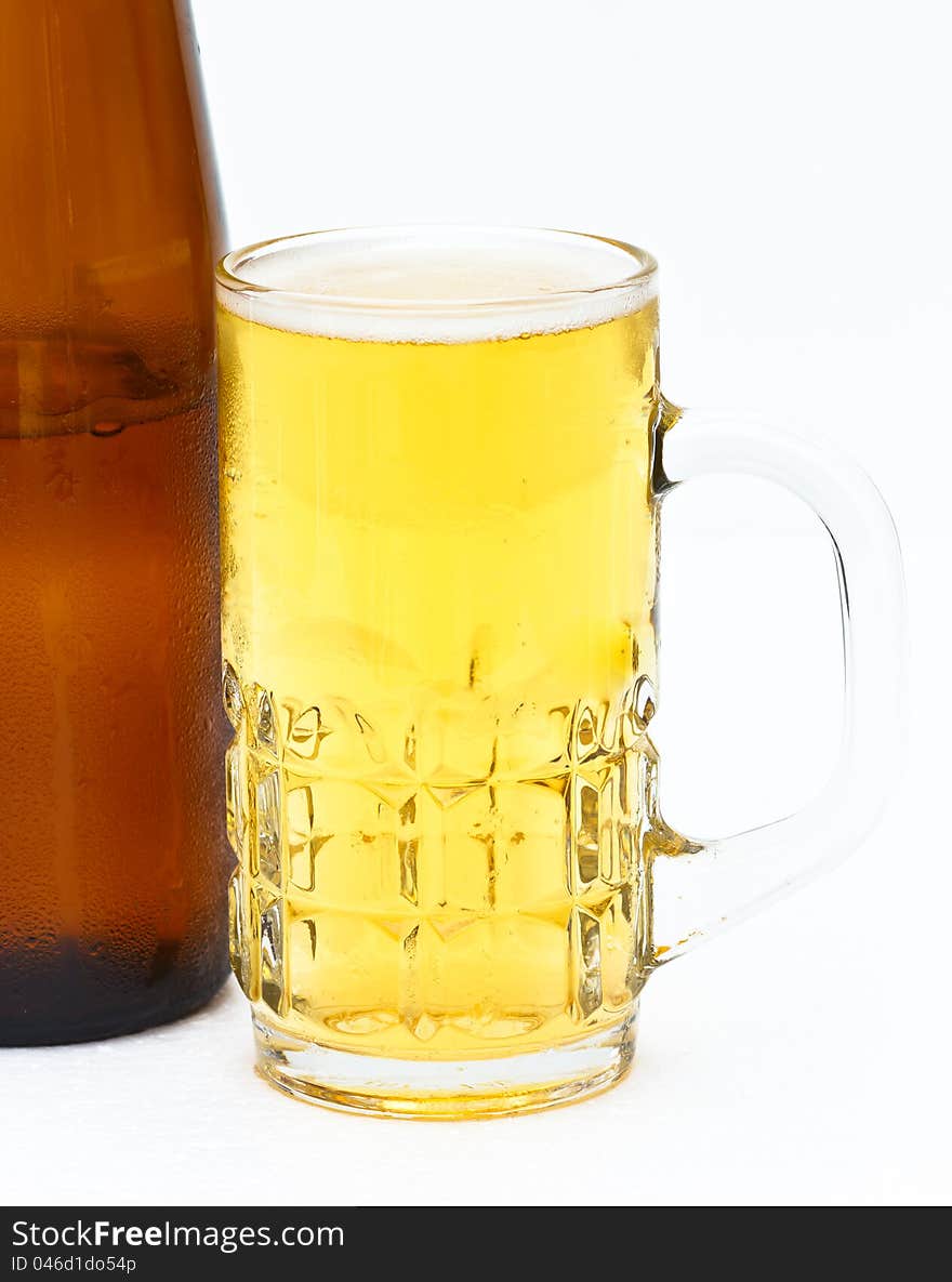 A mug of beer on white background. A mug of beer on white background