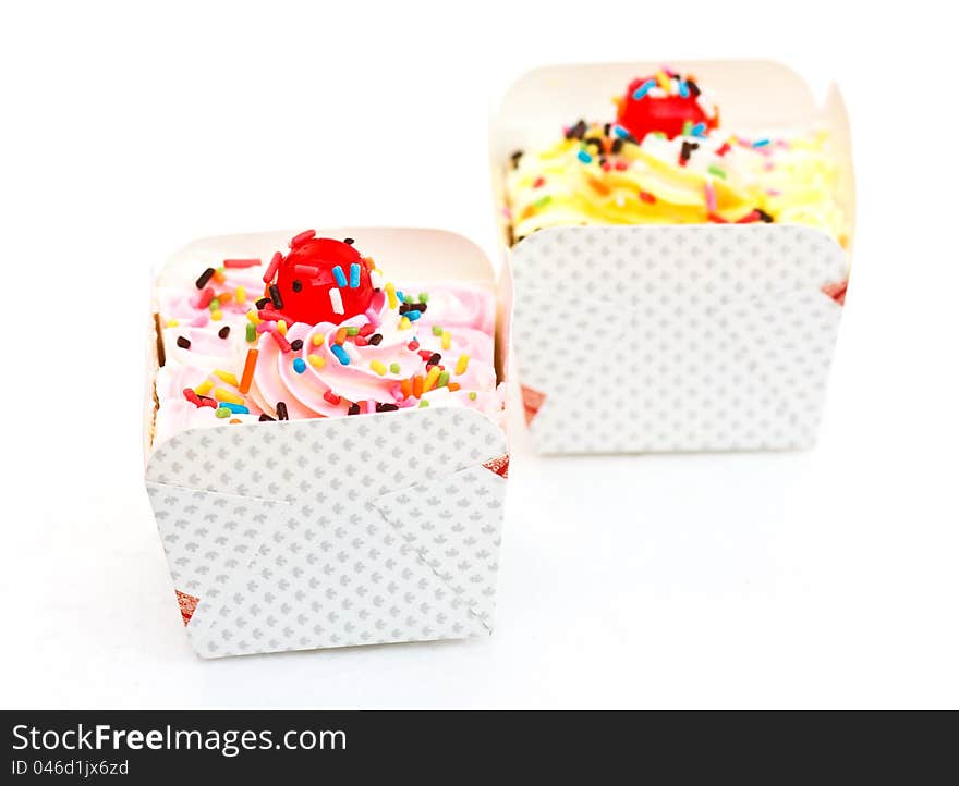 Sweets cupcakes are refreshments on white background. Sweets cupcakes are refreshments on white background